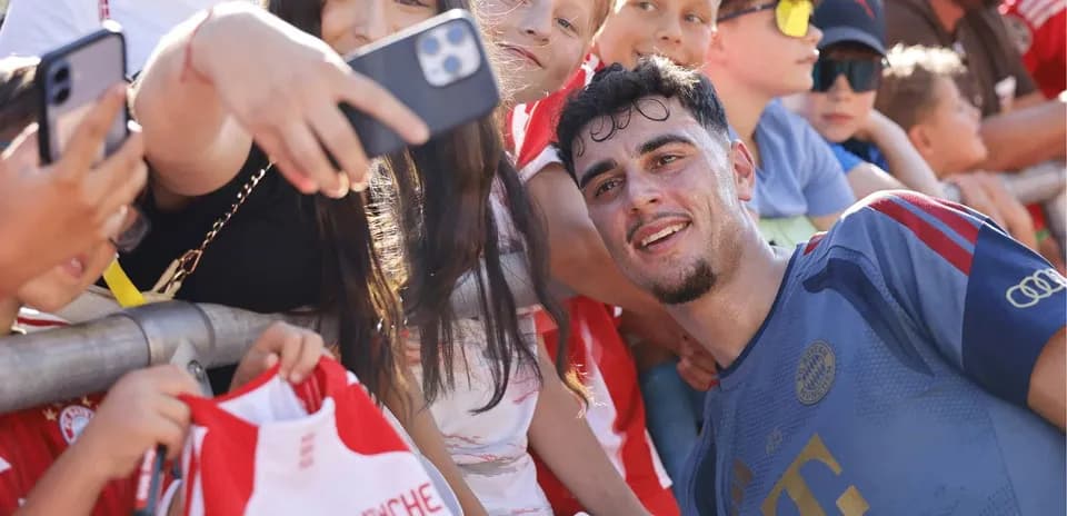 Player taking selfie with fans after match
