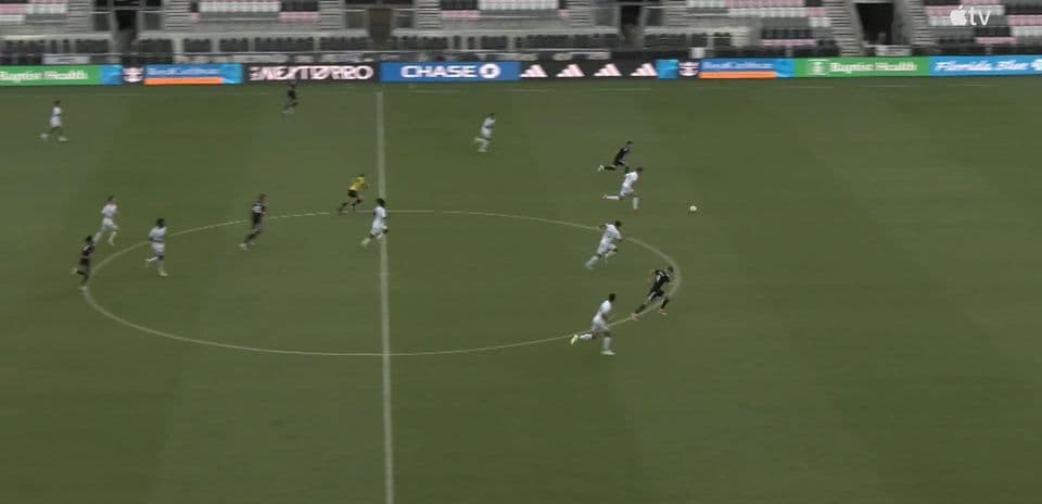 Players competing for the ball during match
