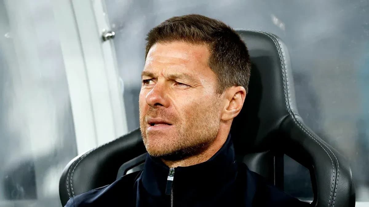 Coach sitting on bench during a match