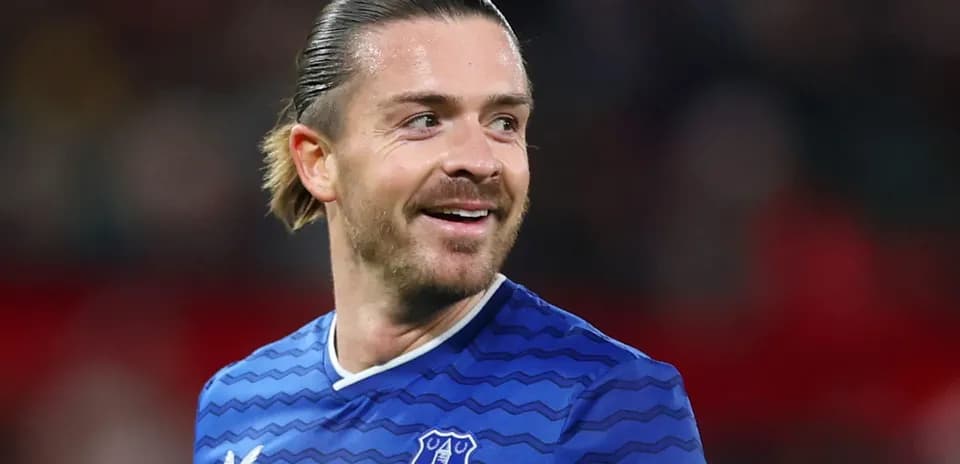 Player smiling in Everton football kit