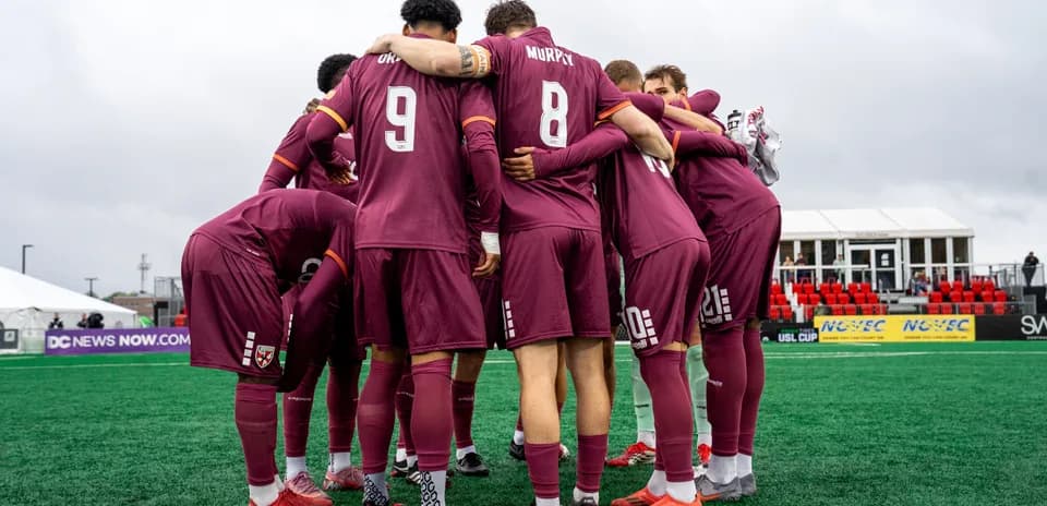 Loudoun United players huddling before the match