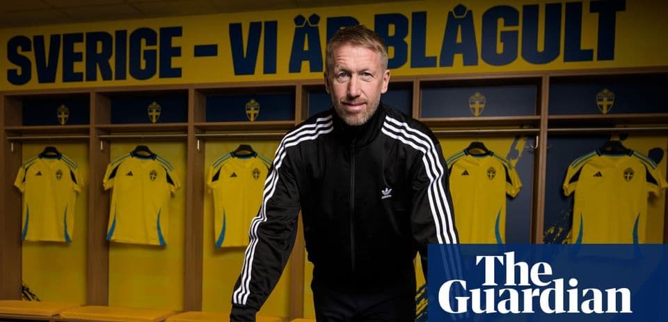 Coach posing in locker room with Swedish jerseys