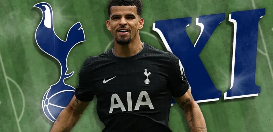 Player in Tottenham kit celebrating on football pitch