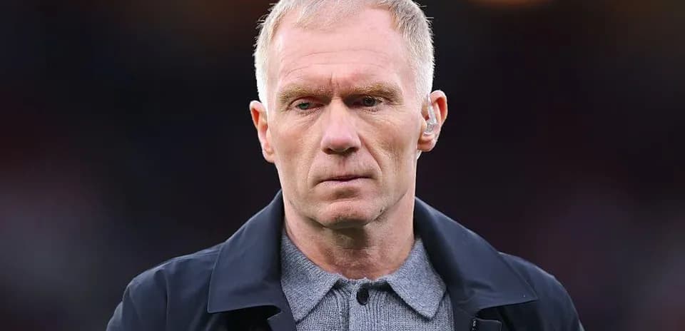 Man in formal attire at a sporting event
