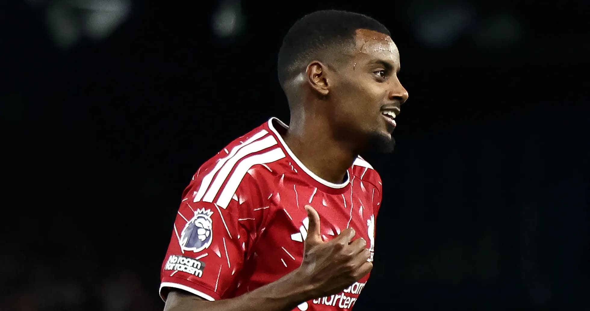 Player celebrating a goal in Liverpool kit