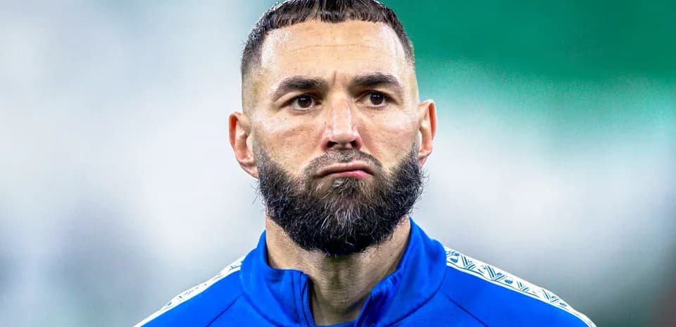 Player in blue training kit with beard and short hair
