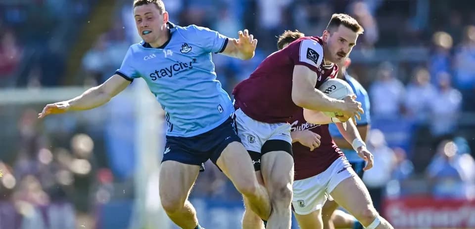 Player tackling opponent while holding the ball