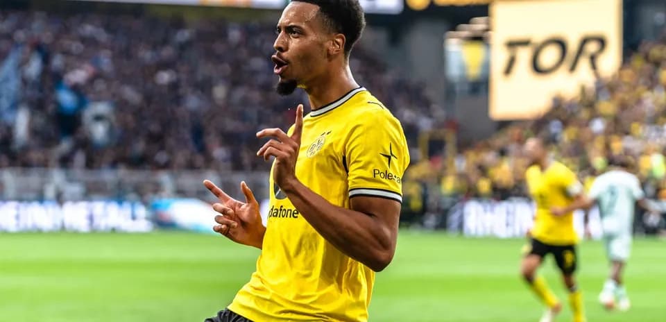 Player celebrating a goal in yellow team jersey