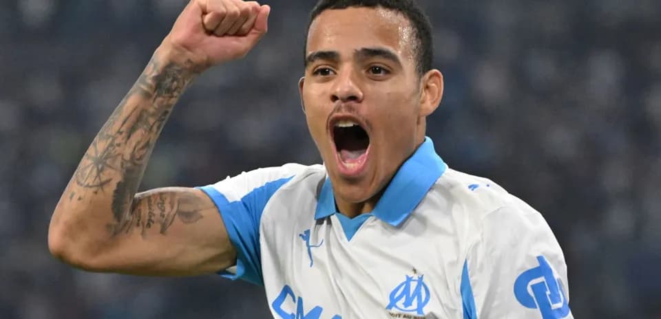 Player celebrating a goal wearing Marseille jersey