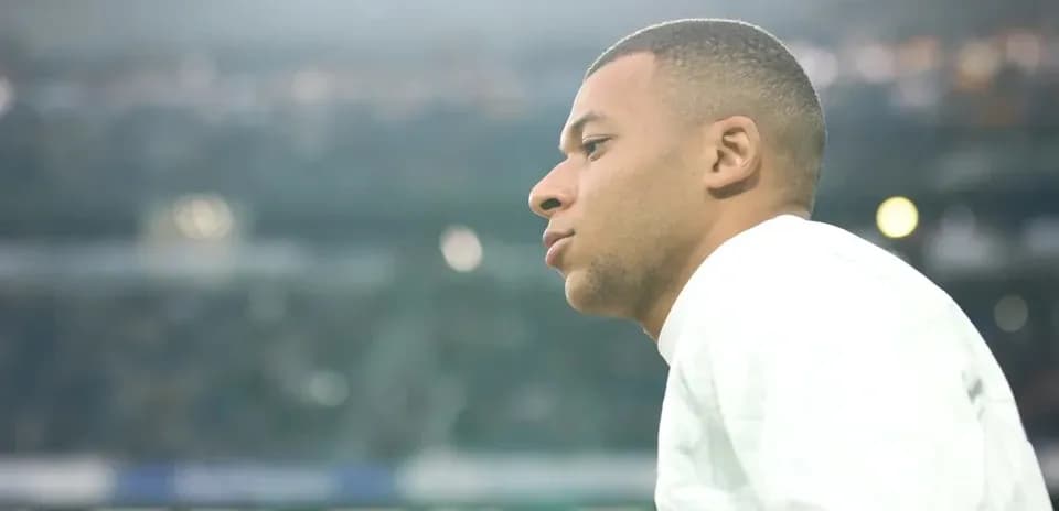 Player looking on from the sidelines during match