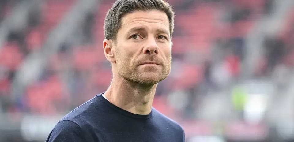 Coach observing from the sidelines during match