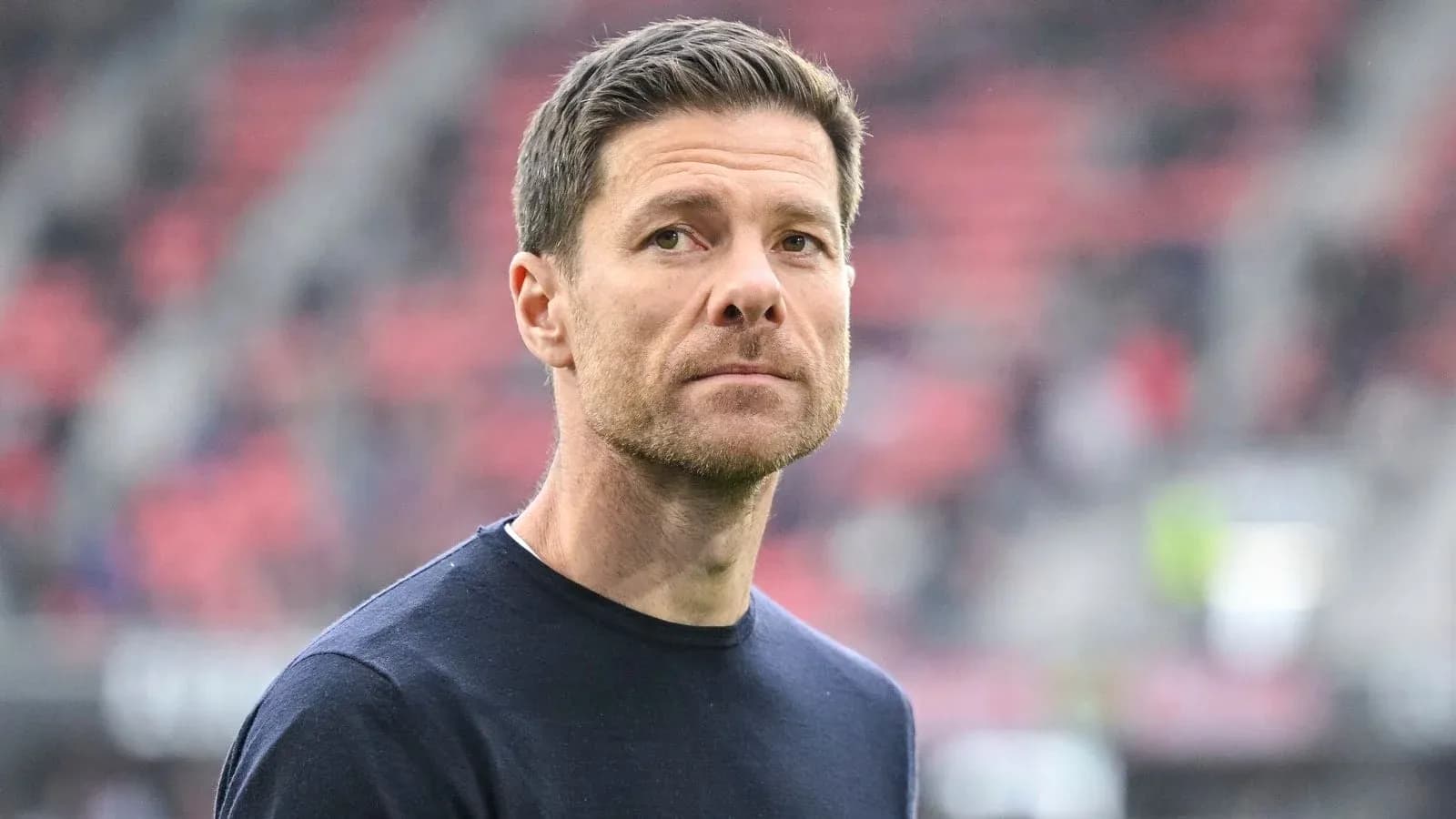 Coach observing from the sidelines during match
