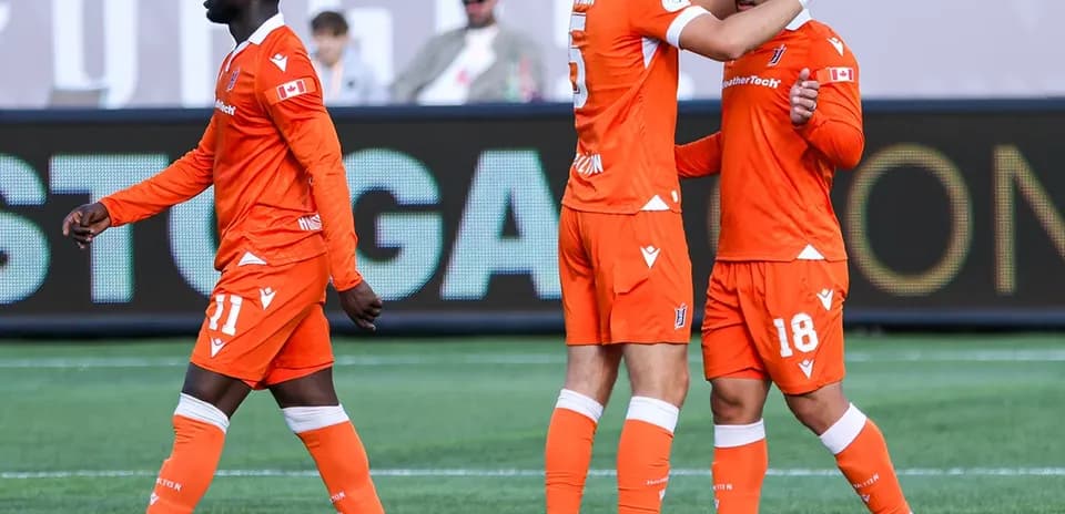 Forge FC players celebrating a goal