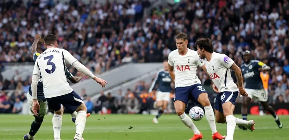 Tottenham players defending during a match action