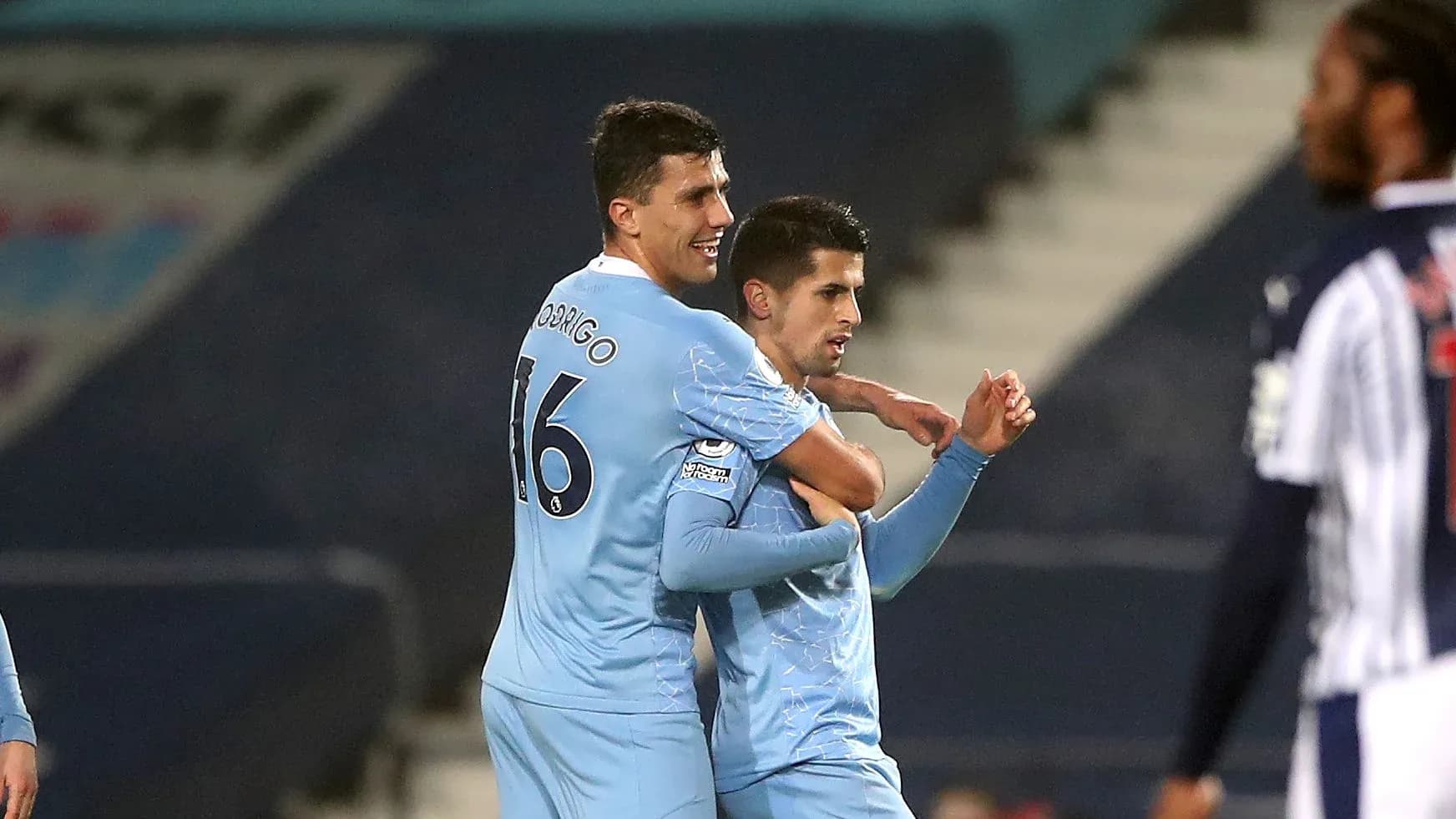 Players celebrating a goal on the pitch