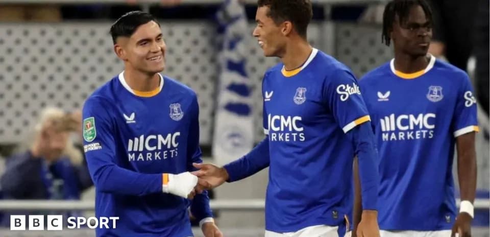 Everton players celebrating on the field after a match