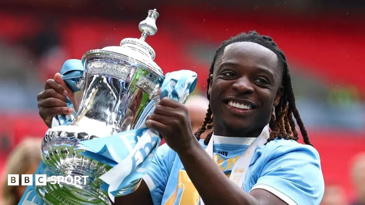 Player celebrating with trophy after match victory