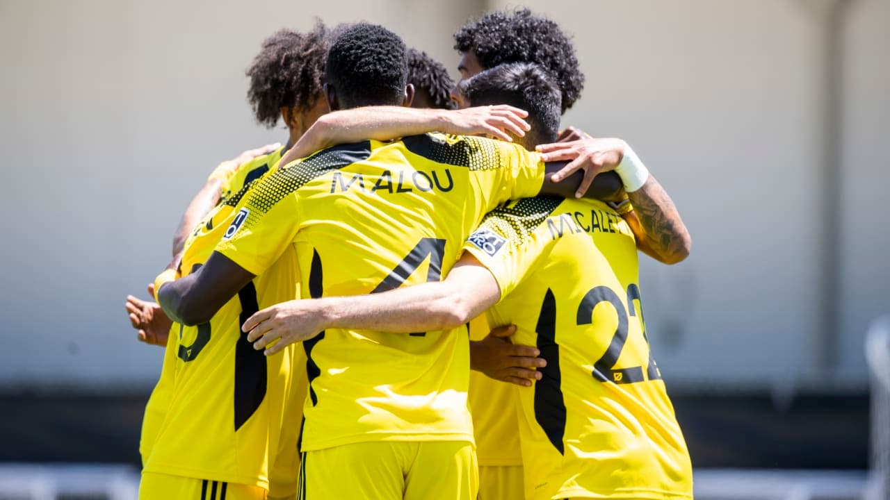 Columbus Crew II players celebrating a goal