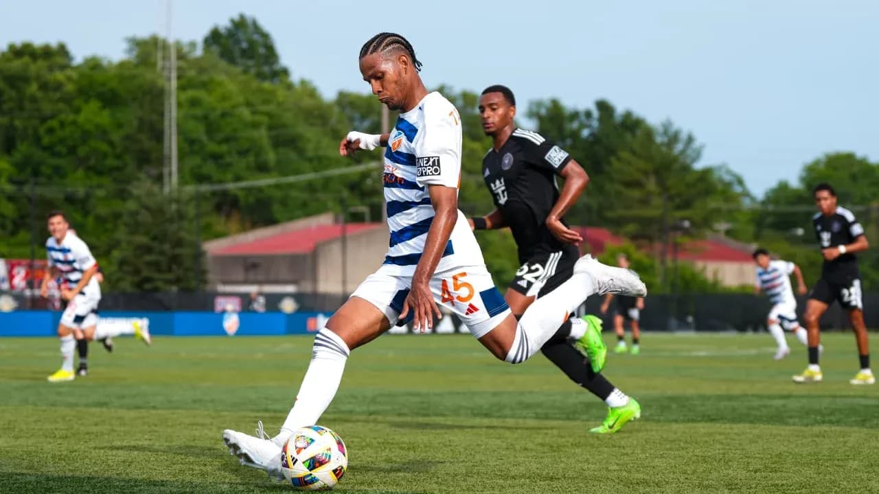 Player kicking the ball during Huntsville City match