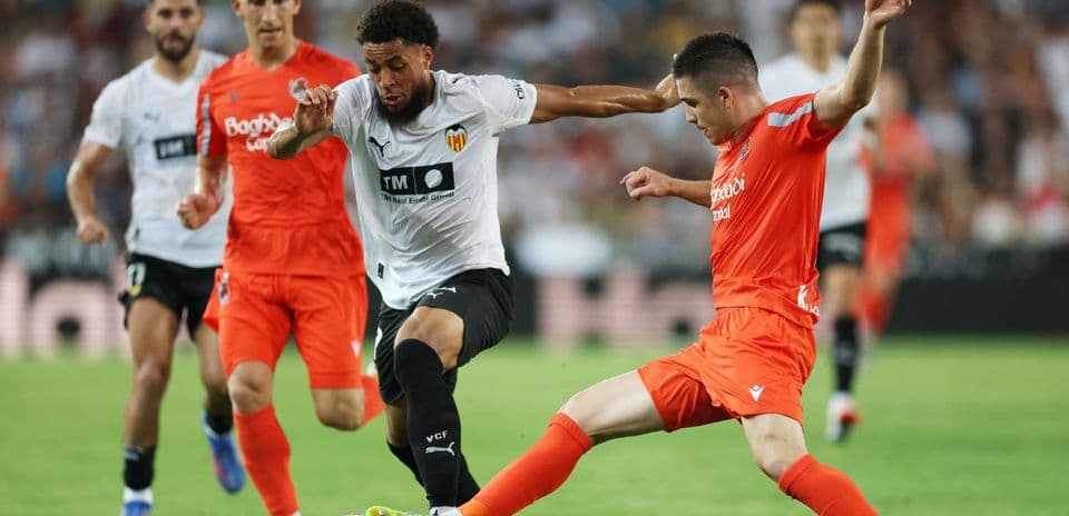 Players competing for the ball during La Liga match