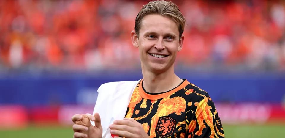 Player in vibrant shirt smiling at the stadium