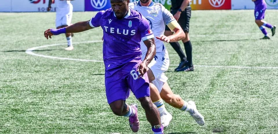Pacific FC player dribbling the ball against HFX Wanderers