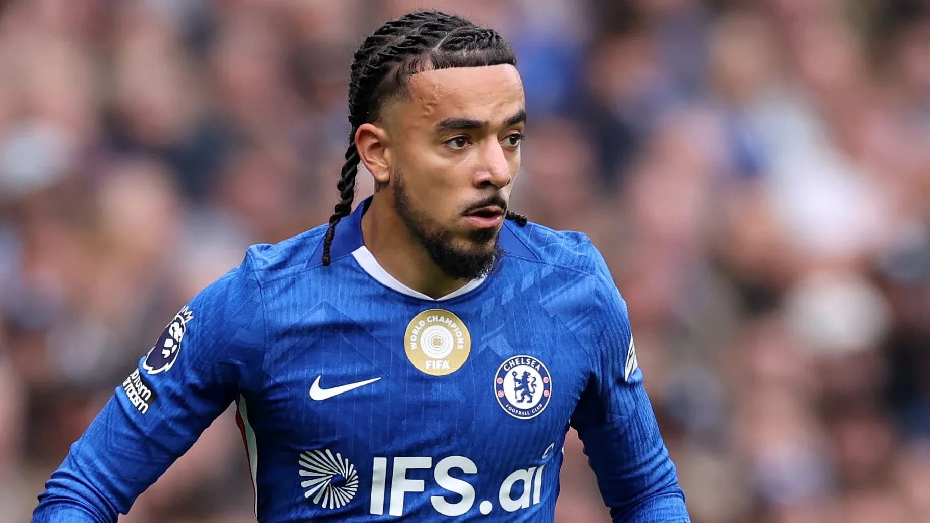 Player wearing Chelsea jersey during match action