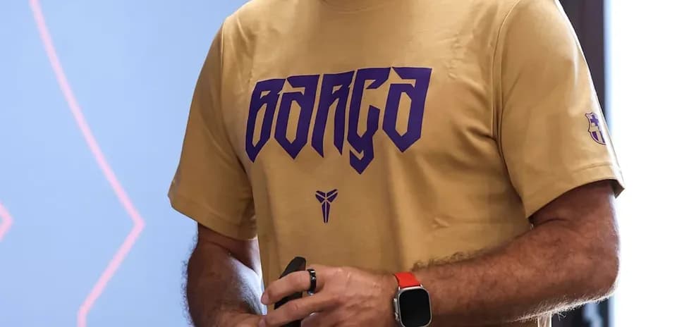 Coach holding a water bottle in training facility