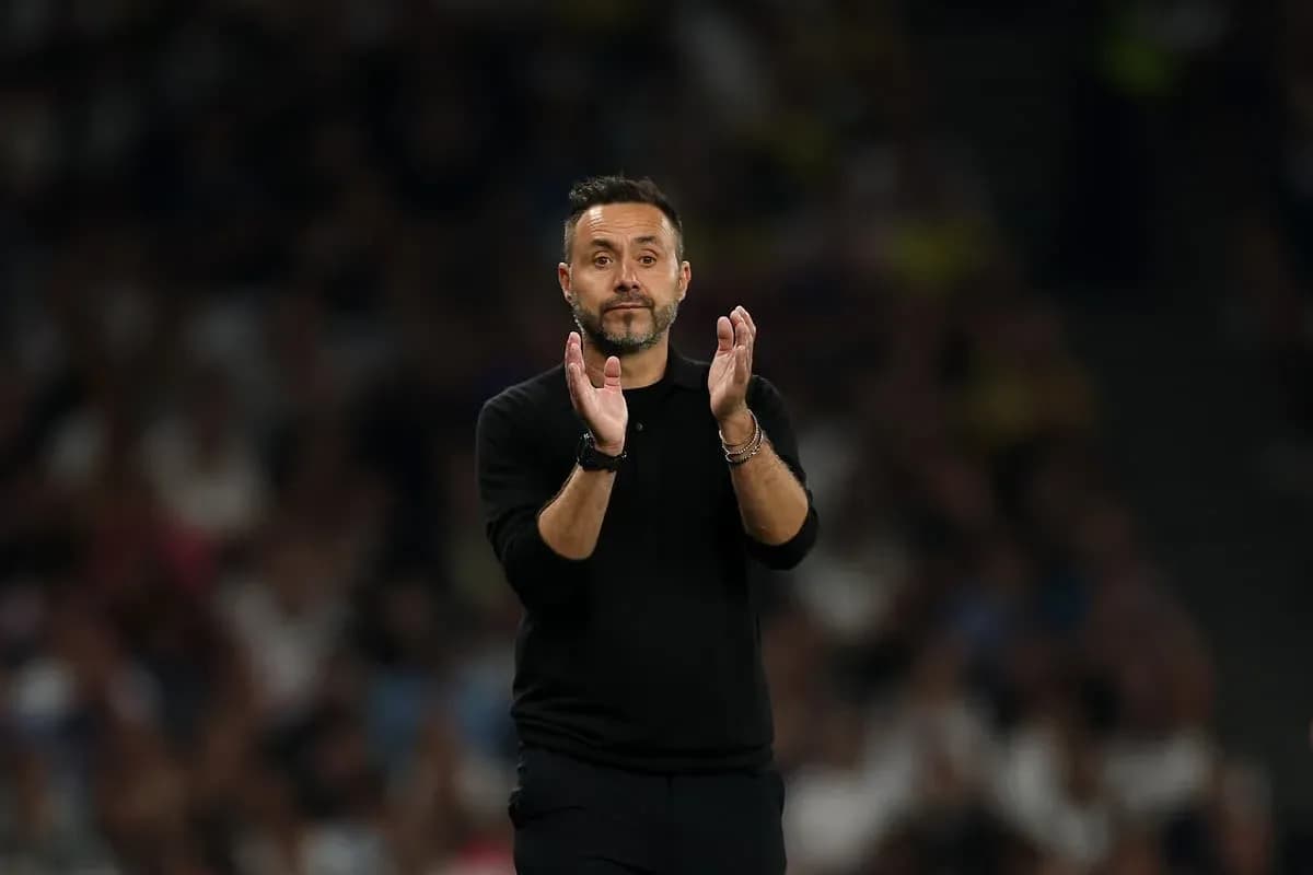 Coach applauding during a match on the sideline