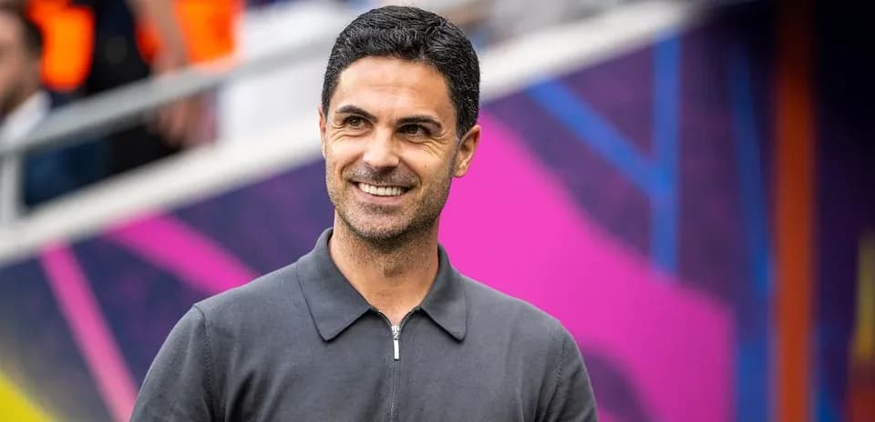 Manager smiling during pre-match warm-up