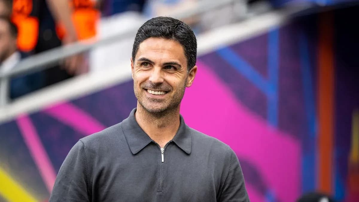 Manager smiling during pre-match warm-up