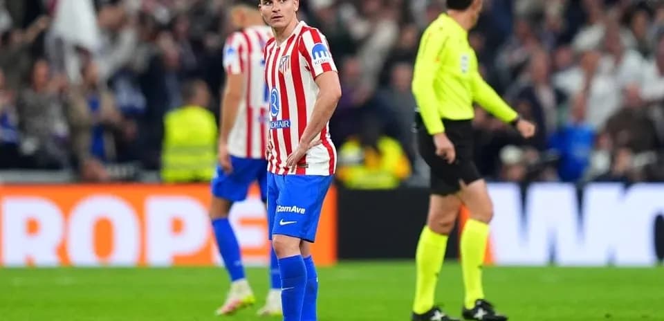 Atletico Madrid player looking concerned during match
