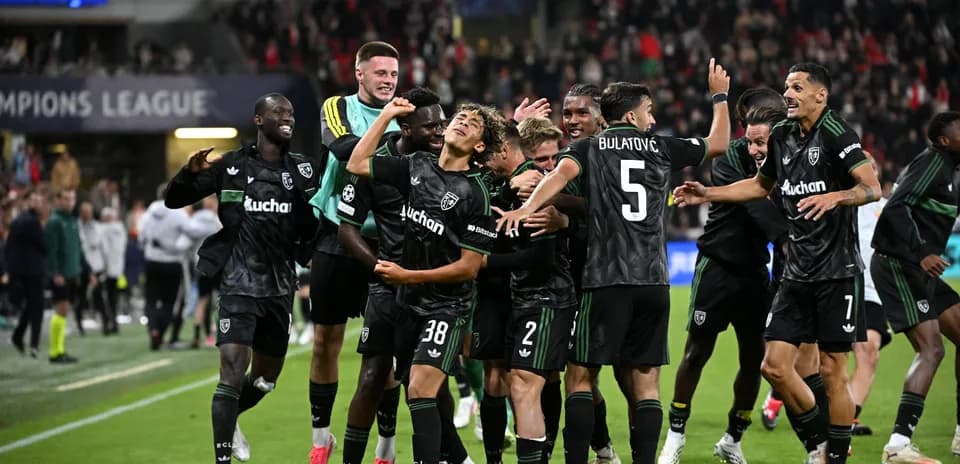 Players celebrating victory after Champions League match
