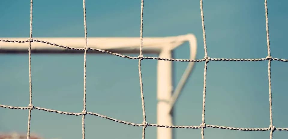 Close-up of a soccer goal net