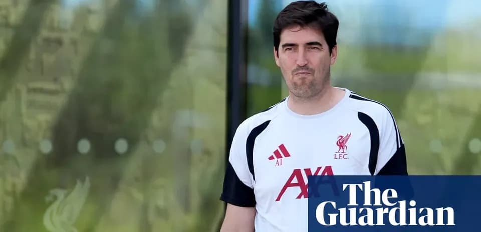 Man in Liverpool training kit walking outside