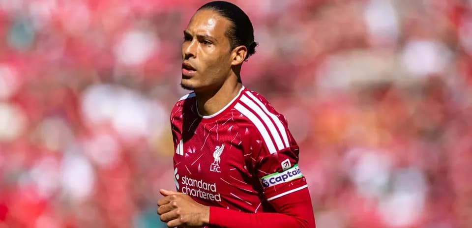 Player in Liverpool kit running on the pitch