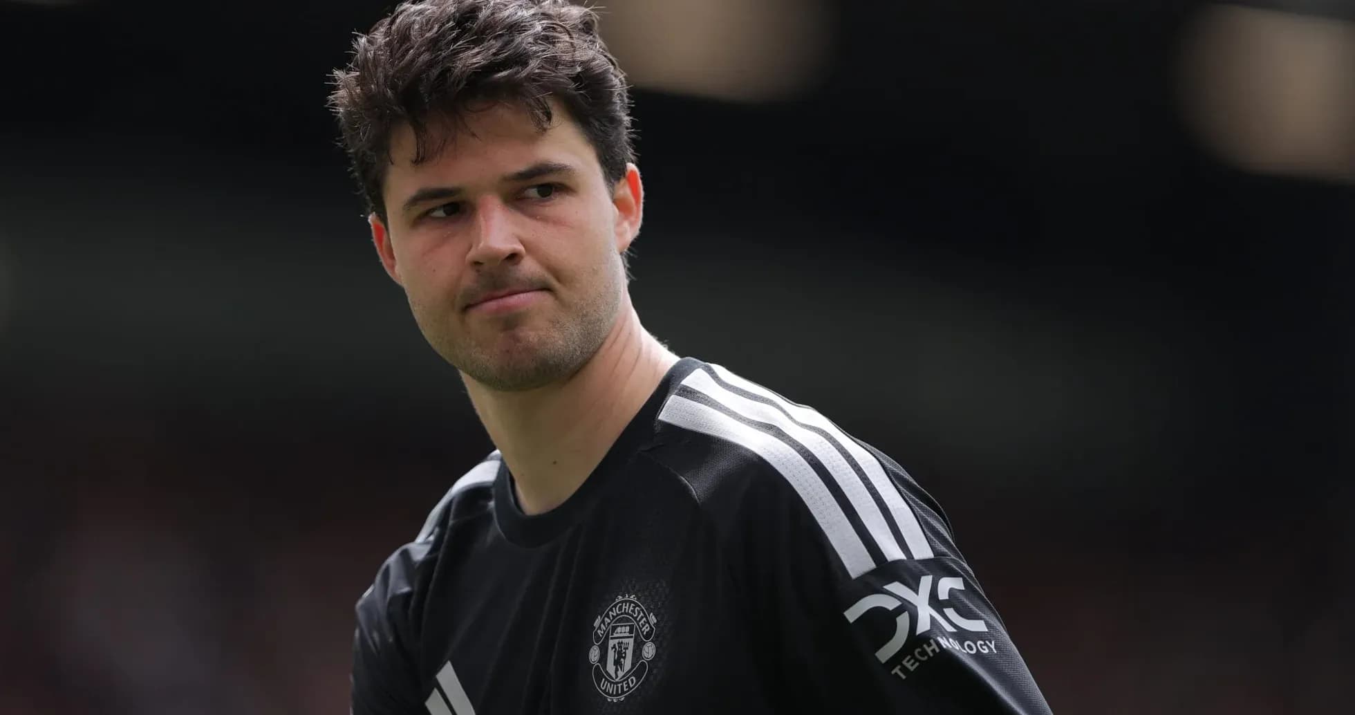 Goalkeeper in Manchester United kit on pitch
