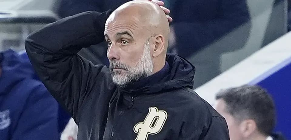 Manager with hand on head during match