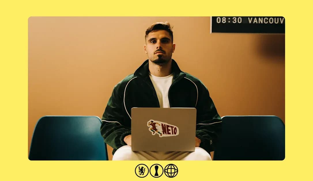 Person sitting with laptop displaying 'NETO' sticker