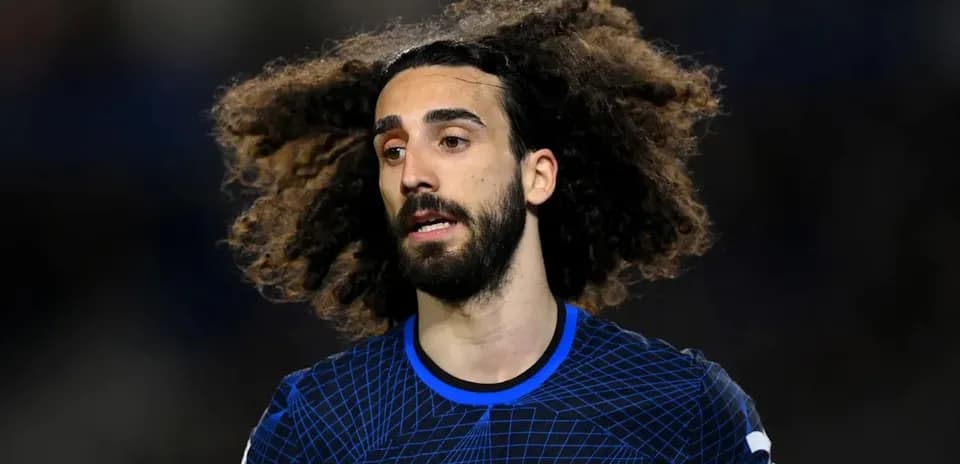 Player with curly hair in Chelsea kit during match