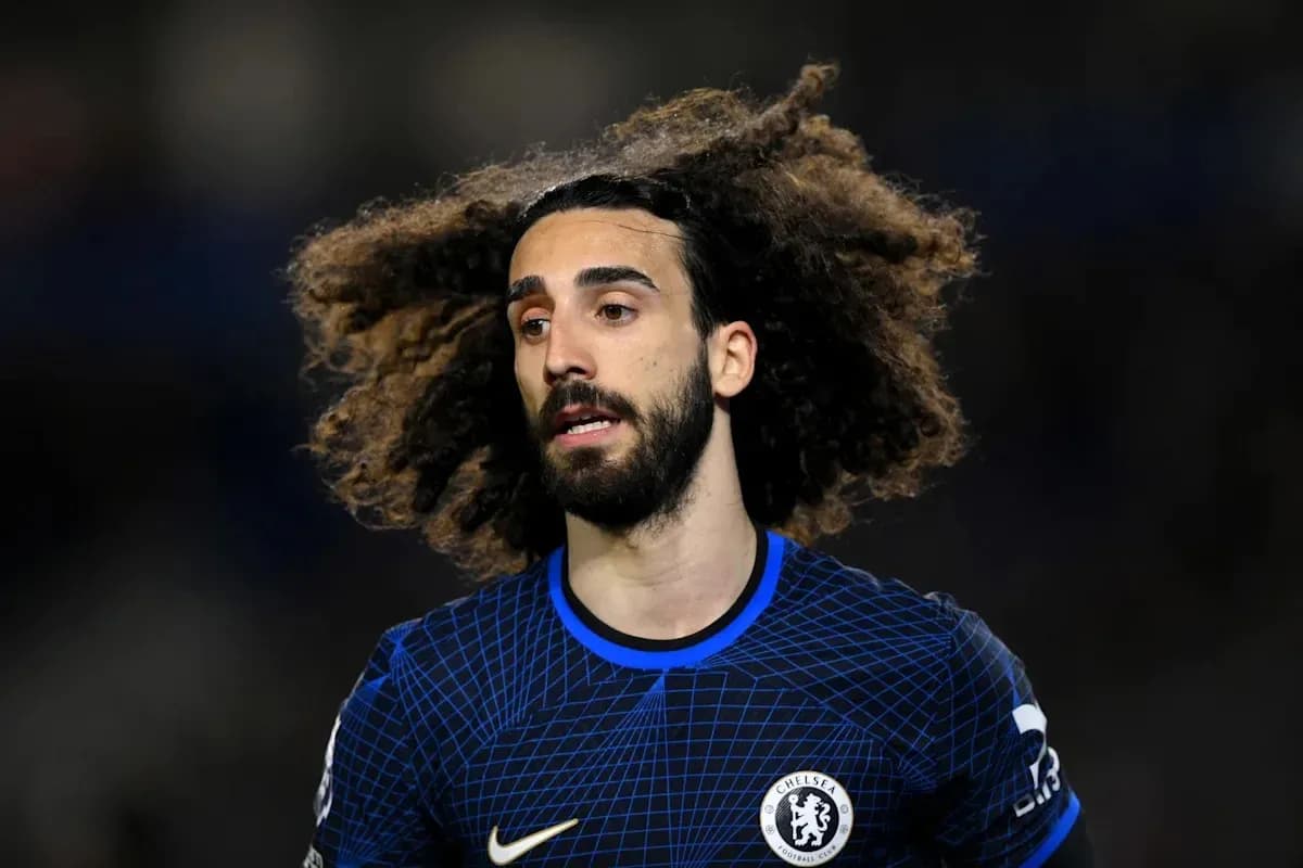 Player with curly hair in Chelsea kit during match