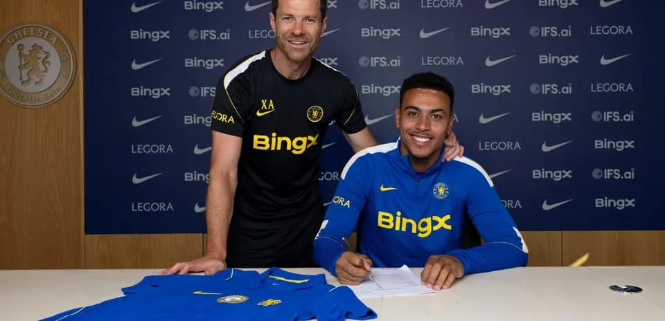 Player signing contract with coach at Chelsea FC