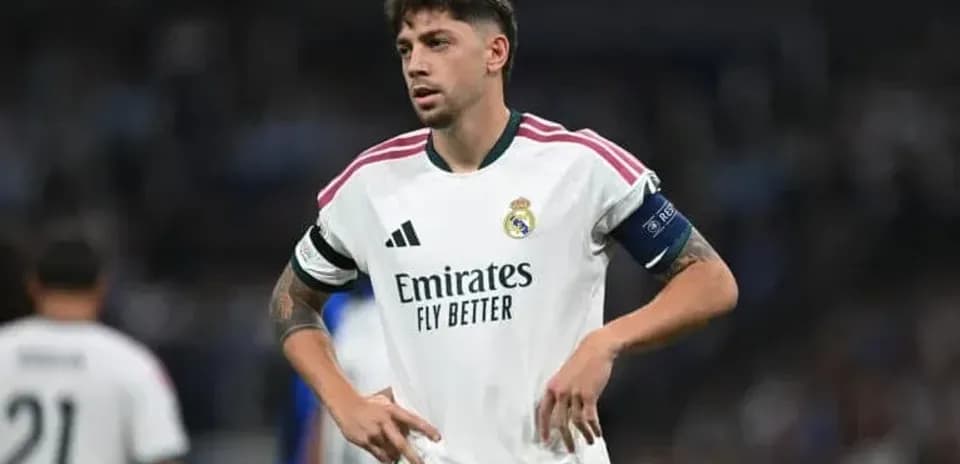 Real Madrid player during a match in white kit