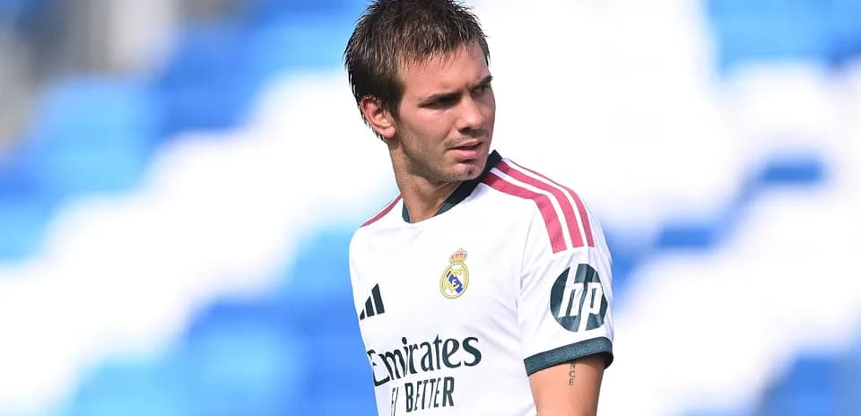 Player wearing Real Madrid jersey on training pitch