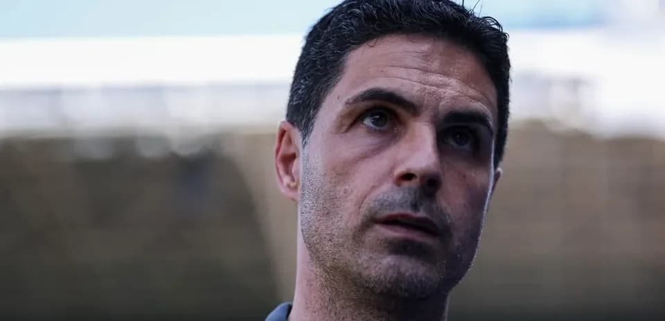 Football manager speaking at press conference