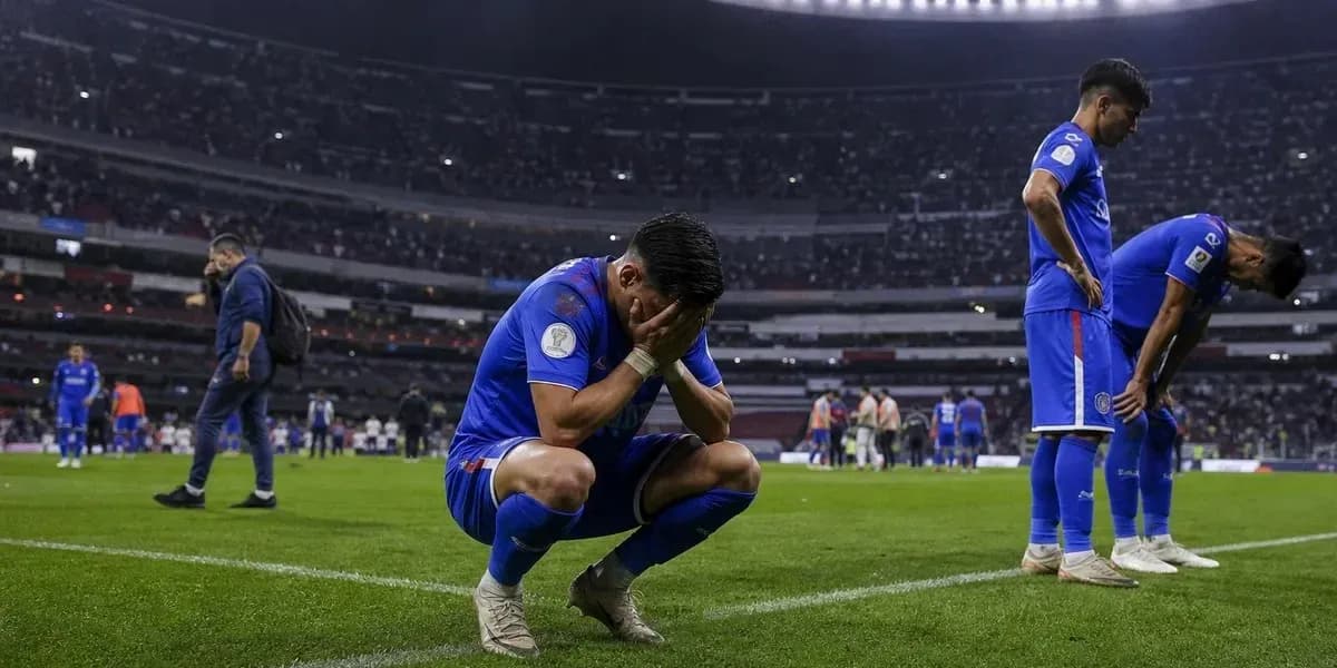 Cruz Azul players react after match loss on field