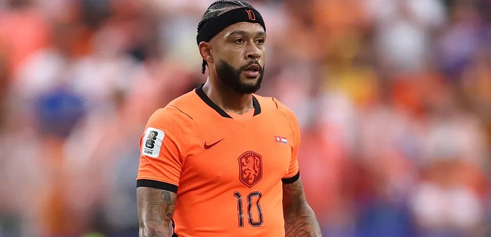 Player wearing orange jersey during football match