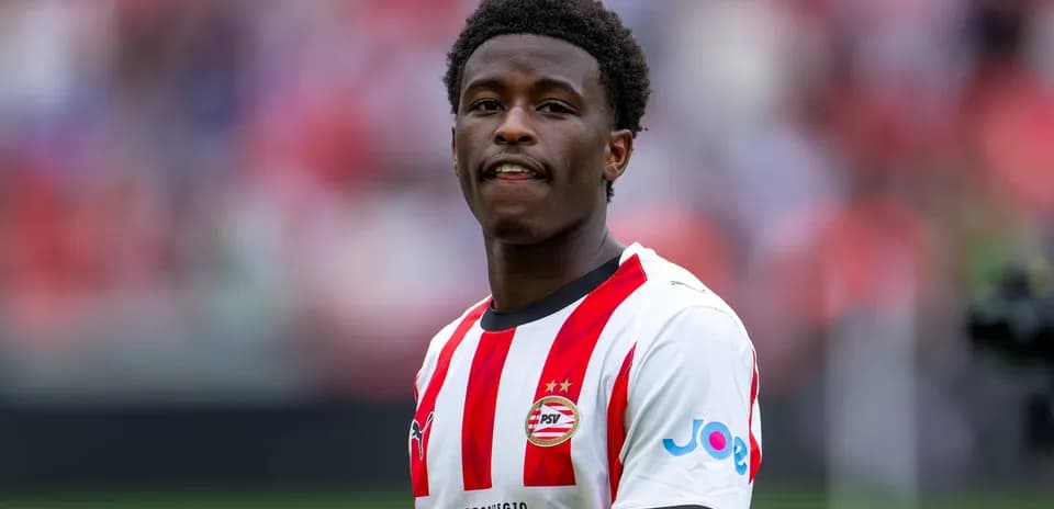 Player in PSV Eindhoven kit at stadium