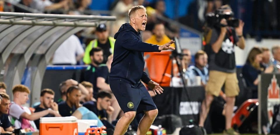 Coach directing players from the sidelines during match