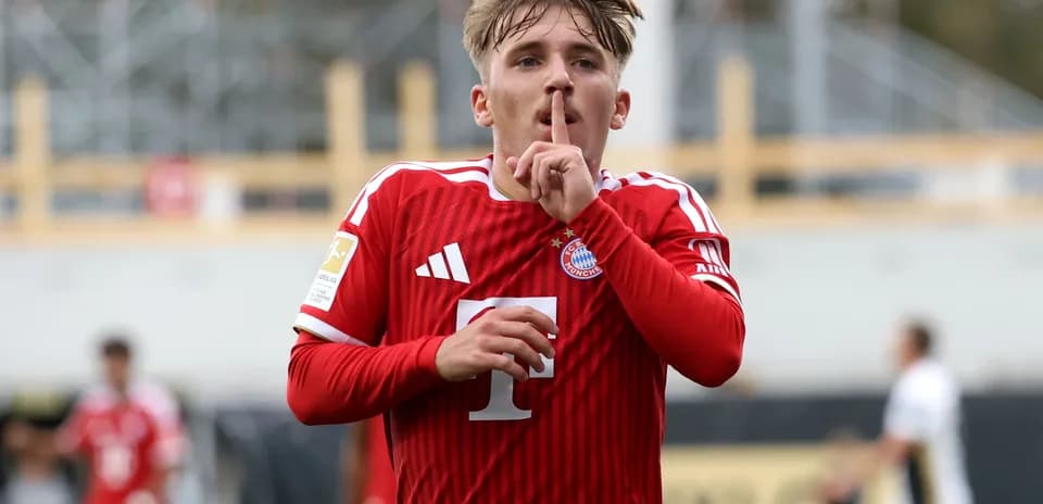 Player celebrating and shushing after scoring a goal